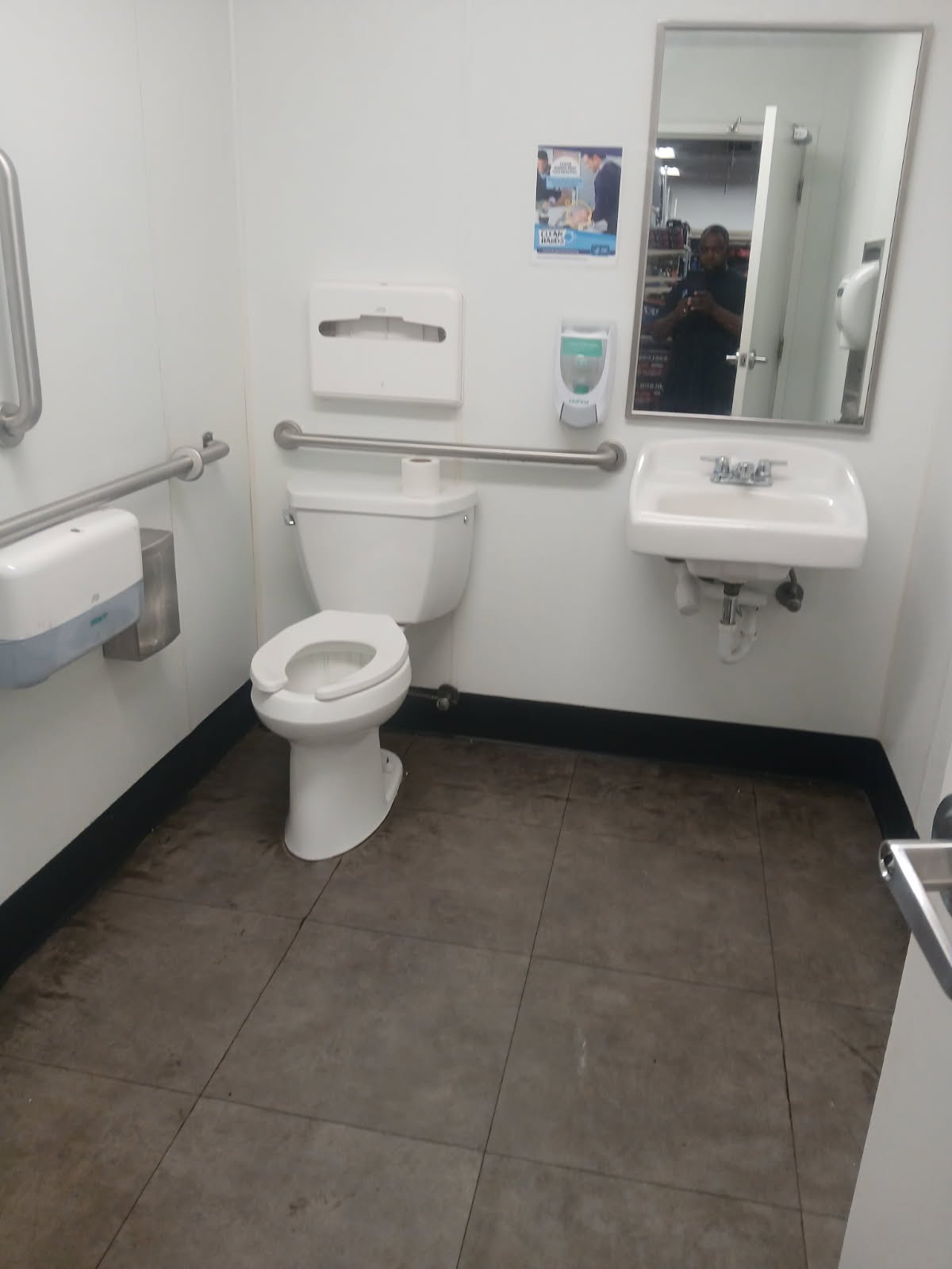 Accessible restroom interior with clean finished walls and installed fixtures
