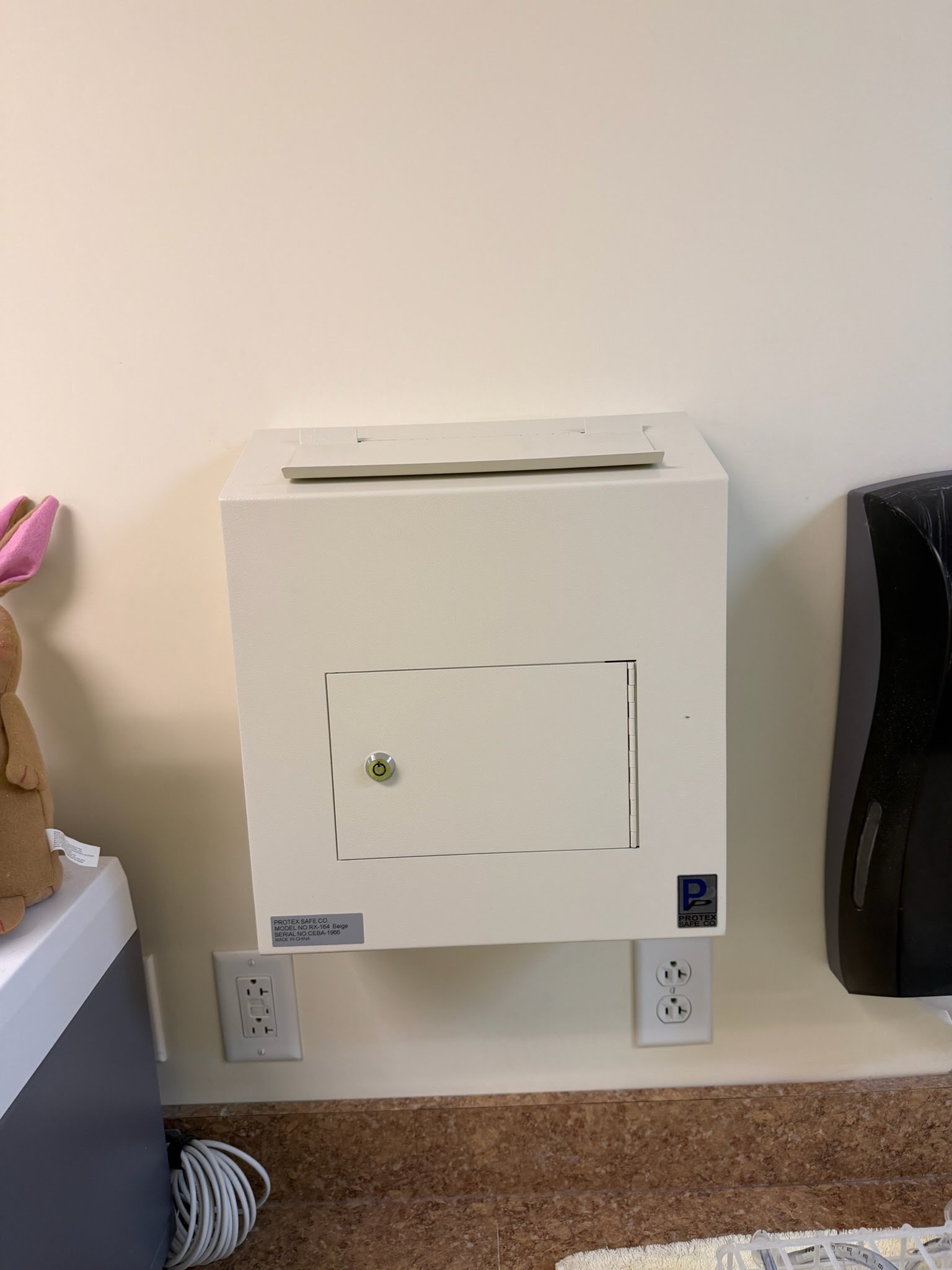 Secure drop-safe fixture mounted to an interior wall