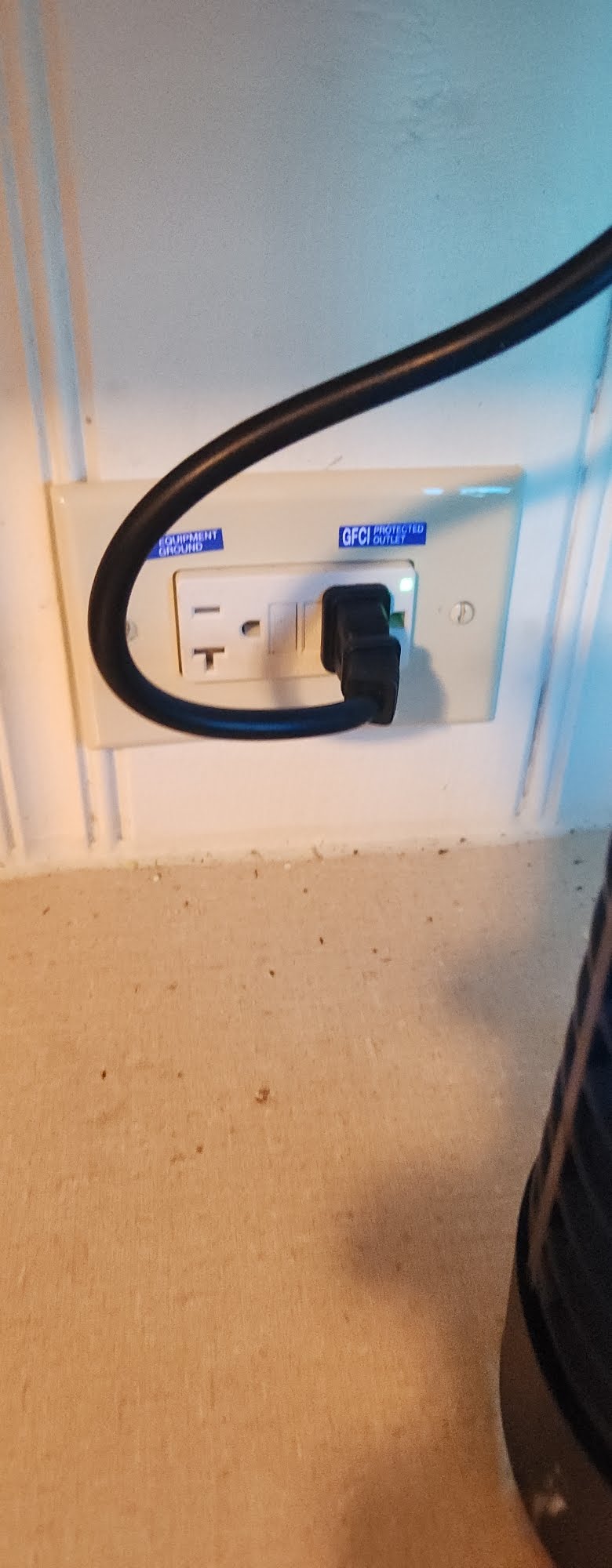 GFCI electrical receptacle installed at a wall