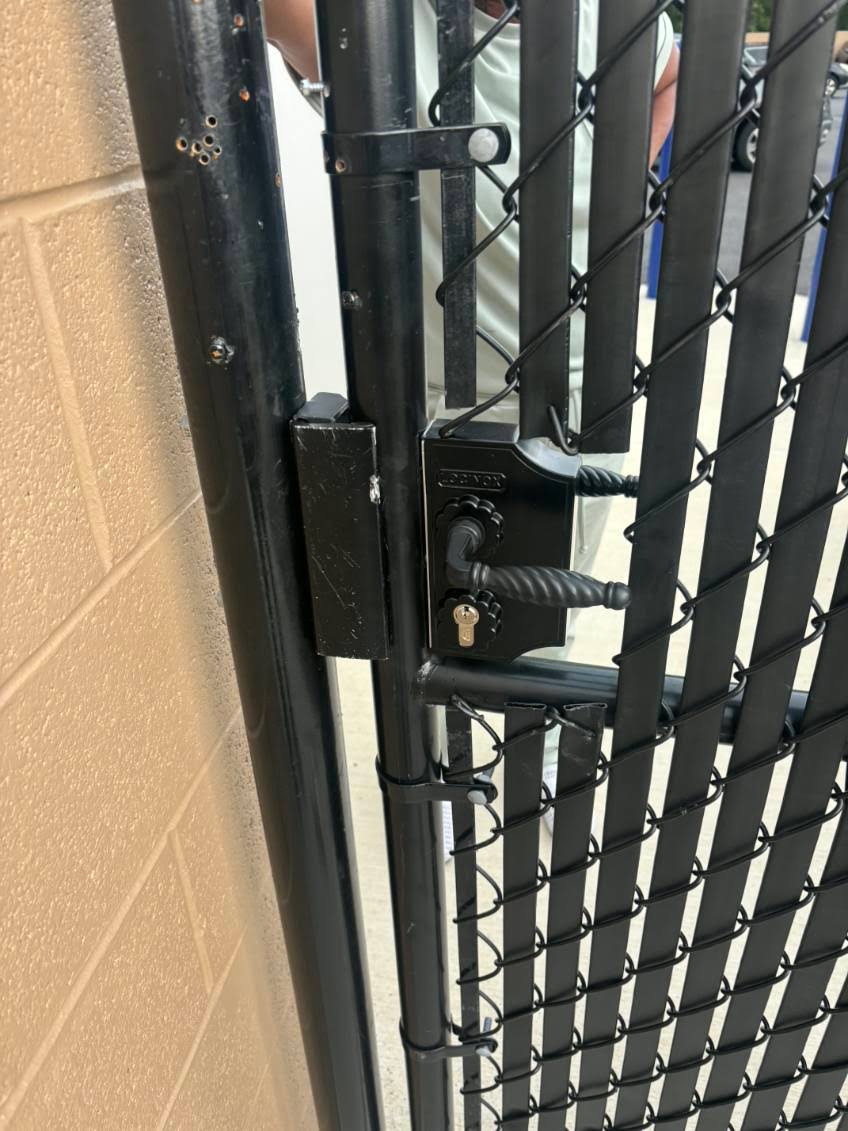 Full keyed lock installation on a chain-link gate