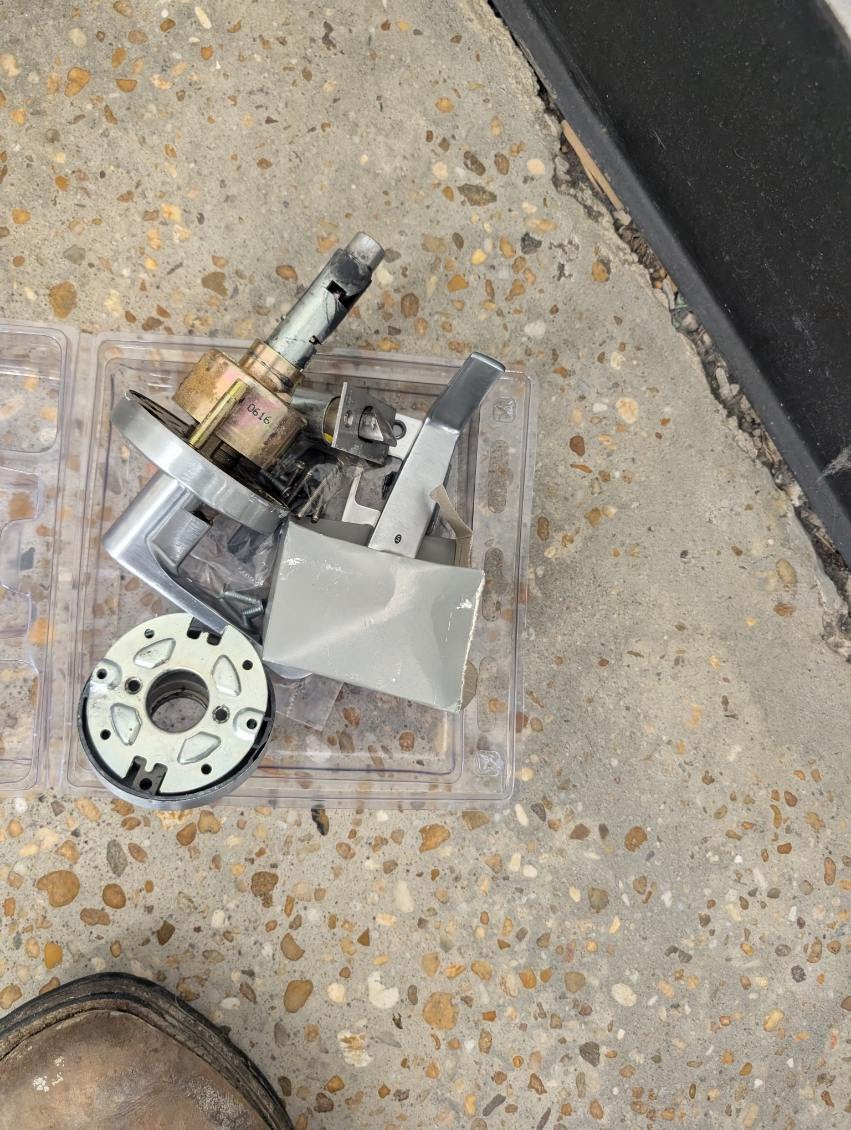 Removed commercial lockset components during replacement