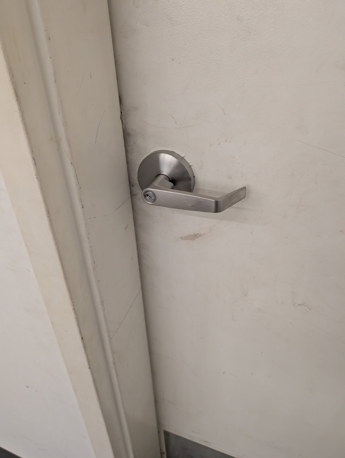 Keyed commercial lever set installed on a door